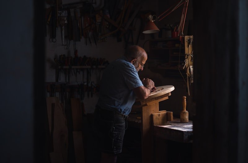 Woodworker turning a piece on a lathe
